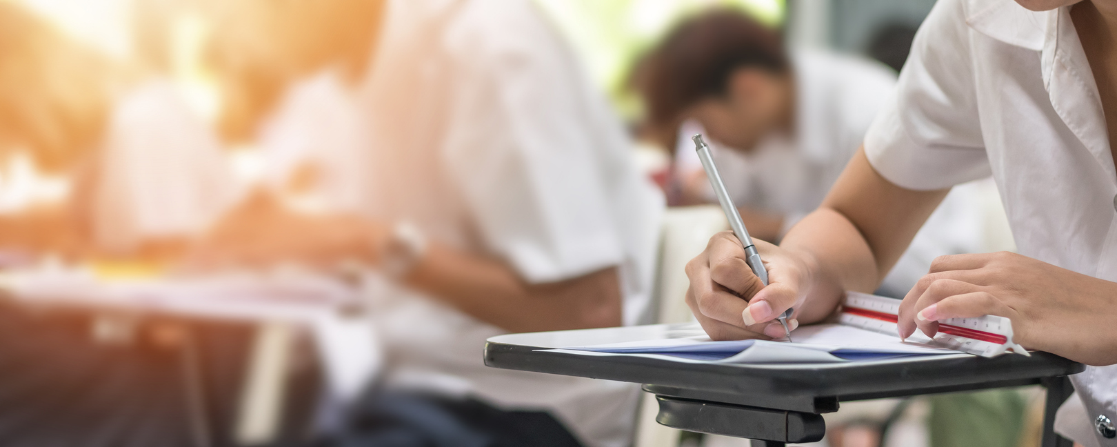 image of students writing notes