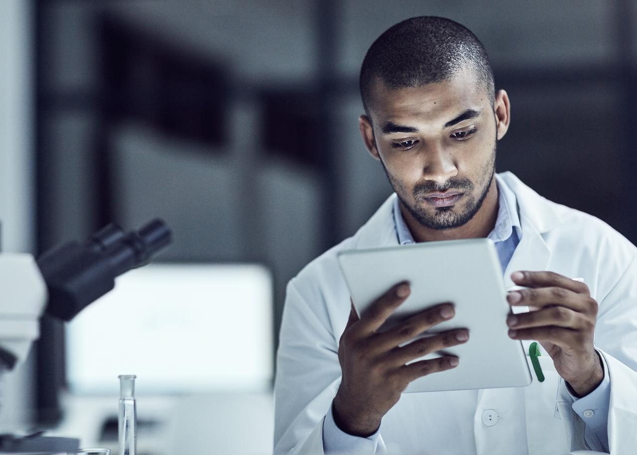 Young apprentice looking at tablet 